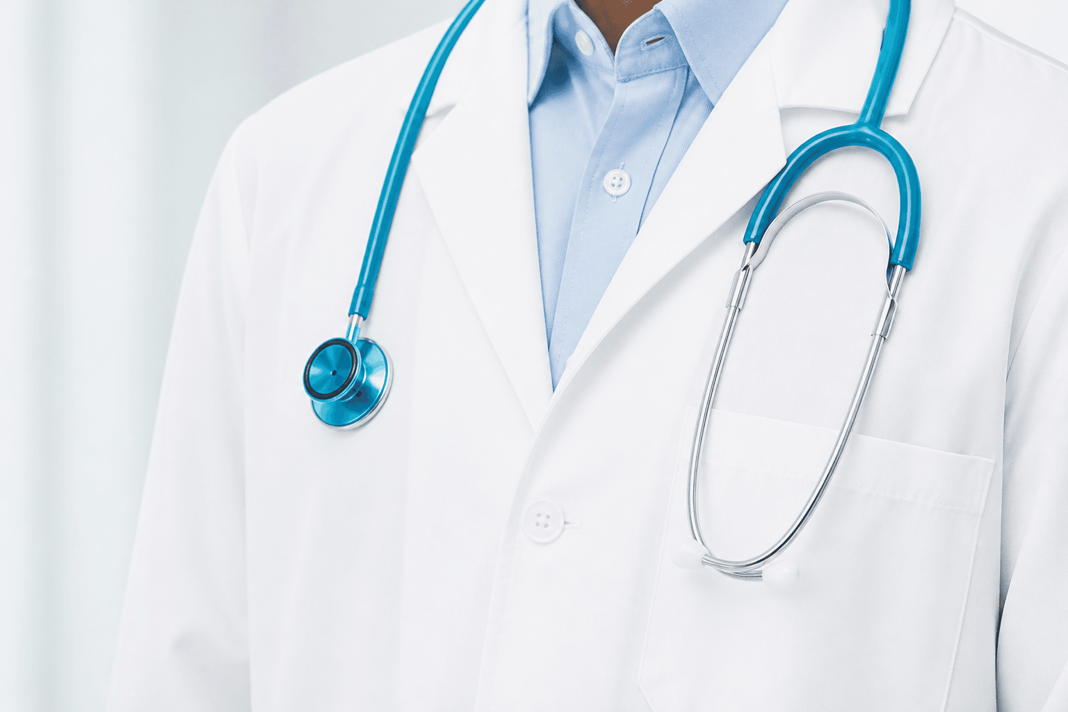 Healthcare professional wearing a stethoscope in a clinical technology setting